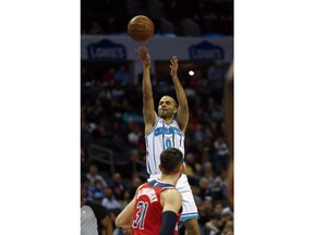 Charlotte Hornets guard Tony Parker (9) shoots over Washington Wizards guard Tomas Satoransky (31) in the first half of an NBA basketball game in Charlotte, N.C., Friday, March 8, 2019.