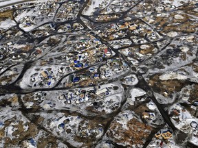 FILE - This Feb. 13, 2017 aerial photo shows the Oceti Sakowin camp, where people have gathered to protest the Dakota Access pipeline on federal land in Cannon Ball, N.D. South Dakota Gov. Kristi Noem says she's proposing legislation ahead of the Keystone XL oil pipeline's construction that would create a legal avenue to pursue out-of-state money that funds protests aimed at slowing construction. Noem's bills come after opponents of the Dakota Access oil pipeline staged large protests that resulted in 761 arrests in southern North Dakota over a six-month span beginning in late 2016. The state spent tens of millions of dollars policing the protests.