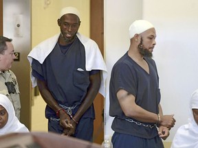 FILE - This Aug. 13, 2018 pool file photo shows defendants, from left, Jany Leveille, Lucas Morton, Siraj Ibn Wahhaj and Subbannah Wahhaj entering district court in Taos, N.M., for a detention hearing. Five former residents of a New Mexico compound where authorities found 11 hungry children and a dead 3-year-old boy are due in federal court on terrorism-related charges. The two men and three women living at the compound raided in August are being arraigned Thursday, March 21, 2019, on new charges of supporting plans for violent attacks.