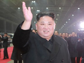 In this March 5, 2019, photo provided by the North Korean government,  North Korean leader Kim Jong Un waves at Pyongyang station as Kim returned home  from Vietnam, where his high-stakes nuclear summit with U.S. President Donald Trump ended without any agreement.