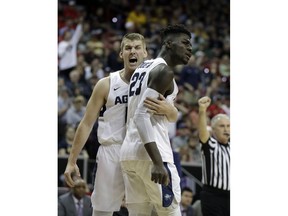 Utah State's Quinn Taylor, left, and Neemias Queta react after a foul call during the first half of an NCAA college basketball game against San Diego State in the Mountain West Conference men's tournament championship Saturday, March 16, 2019, in Las Vegas.