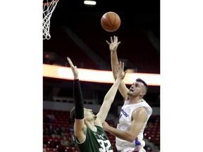 Boise State's Zach Haney, right, shoots over Colorado State's Nico Carvacho (32) during the first half of an NCAA college basketball game in the Mountain West Conference tournament, Wednesday, March 13, 2019, in Las Vegas.