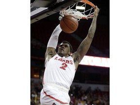 New Mexico's Corey Henson dunks during the second half of the team's NCAA college basketball game against Wyoming in the Mountain West Conference men's tournament Wednesday, March 13, 2019, in Las Vegas.