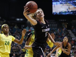 Stanford's Alanna Smith (11) grabs a rebound against Oregon during the first half of an NCAA college basketball game in the final of the Pac-12 women's tournament Sunday, March 10, 2019, in Las Vegas.