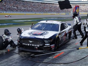 Kevin Harvick makes a pit stop during a NASCAR Cup Series auto race at Las Vegas Motor Speedway, Sunday, March 3, 2019, in Las Vegas.