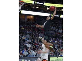 Colorado's Daylen Kountz, top, dunks against Oregon State during the first half of an NCAA college basketball game in the quarterfinal round of the Pac-12 men's tournament Thursday, March 14, 2019, in Las Vegas.