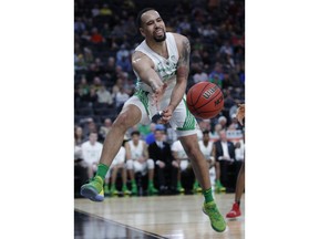 Oregon's Paul White keeps the ball in play during the first half of the team's NCAA college basketball game against Washington State in the first round of the Pac-12 men's tournament Wednesday, March 13, 2019, in Las Vegas.