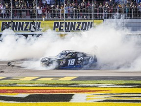 Kyle Busch celebrates with a burnout after winning the NASCAR Xfinity Series auto race Saturday, March 2, 2019, at Las Vegas Motor Speedway in Las Vegas.