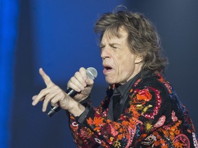 FILE - In this Oct. 22, 2017 file photo, Mick Jagger of the Rolling Stones performs during the concert of their 'No Filter' Europe Tour 2017 at U Arena in Nanterre, outside Paris, France. The Rolling Stones are postponing their latest tour so Jagger can receive medical treatment.  The band announced Saturday, March 30, 2019 that Jagger "has been advised by doctors that he cannot go on tour at this time." The band added that Jagger "is expected to make a complete recovery so that he can get back on stage as soon as possible."