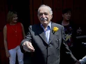 FILE - In this March 6, 2014 file photo, Gabriel Garcia Marquez greets fans and reporters outside his home on his birthday in Mexico City. Netflix has acquired the rights to Marquez's "One Hundred Years of Solitude," one of the most celebrated novels of the 20th century. The streaming company announced Wednesday, March 6, 2019 that it will adapt the 1967 book into a Spanish language series.