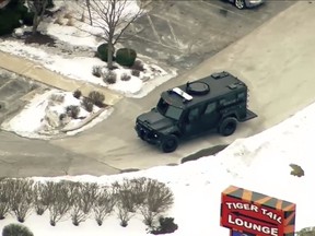 This image provided by ABC 7 Chicago shows police activity at a hotel in Rockford, Ill., Thursday, March 7, 2019. Authorities say an officer has been shot at the hotel in northern Illinois.   Local media was reporting that Rockford police were responding to an active shooter at a hotel.  (ABC 7 Chicago via AP)