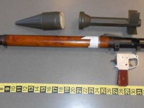 This photo provided by the Transportation Security Administration shows a defunct grenade launcher that TSA agents spotted in a passenger's checked bag at Lehigh Valley Airport in Allentown,  Pa  The TSA says the unassembled parts of the launcher and a replica grenade were found on Monday, March 4, 2019,  when an alarm went off as the bag passed through security equipment at the airport, about 60 miles (96 kilometers ) north of Philadelphia.  The man, from St. Augustine, Fla., was stopped by police and told officials he thought he could bring the non-functioning launcher onboard in a checked bag.  (Transportation Security Administration via AP)
