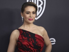 FILE - In this Jan. 6, 2019 file photo, Alyssa Milano arrives at the InStyle and Warner Bros. Golden Globes afterparty at the Beverly Hilton Hotel in Beverly Hills, Calif.  More than 40 Hollywood celebrities have signed a letter sent to Georgia Gov. Brian Kemp and House Speaker David Ralston saying they will urge TV and film production companies to abandon the state if a "heartbeat" abortion bill becomes law.  The bill prohibits most abortions after six weeks from conception and could come to a House vote as early as Thursday, March 28. If approved, it will go to Kemp, who's expected to sign it.