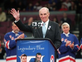 FILE - In this Sunday, Feb. 22, 2009 file photo, Harry Howell waves to the crowd during a ceremony to retire his number before the Ranger's hockey game at Madison Square Garden in New York. NHL Hall of Fame defenseman Harry Howell, who played the most games in the history of New York Rangers, has died. He was 86. Howell died Saturday night, March 9, 2019. Howell played 1,160 games for the Rangers from 1952-69 and had his No. 3 retired by the team.