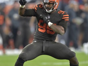 FILE - In this Sept. 20, 2018, file photo, Cleveland Browns defensive end Myles Garrett (95) celebrates a sack during an NFL football game against the New York Jets, in Cleveland. General manager John Dorsey has revamped the Cleveland Browns roster. From hopeless to hopeful. Finally.