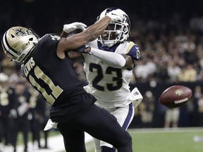 FILE - In this Jan. 20, 2019, file photo, Los Angeles Rams' Nickell Robey-Coleman breaks up a pass intended for New Orleans Saints' Tommylee Lewis during the second half of the NFL football NFC championship game in New Orleans. Reviewing penalty calls, including pass interference, will be among proposals NFL owners will hear to expand the use of replay when they meet next week in Phoenix. Expanding replay has become a scorching topic since the NFC championship game, when a non-call on a blatant pass interference and helmet-to-helmet hit by Rams defensive back Nickell Robey-Coleman likely cost the Saints a trip to the Super Bowl.