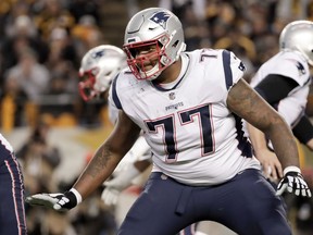 FILE - In this Dec. 16, 2018, file photo, New England Patriots offensive tackle Trent Brown (77) plays against the Pittsburgh Steelers in an NFL football game,in Pittsburgh. The Oakland Raiders have agreed to sign free agent offensive tackle Trent Brown to a four-year deal worth a record $66 million. A person familiar with the contract said Monday, March 11, 2019, that Brown will receive $36.75 million guaranteed in the richest contract ever for an offensive lineman. The person spoke on condition of anonymity because the deal can't be finalized until the new league year starts Wednesday.