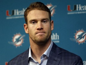 FILE - In this Dec. 30, 2018, file photo, Miami Dolphins quarterback Ryan Tannehill answers question during a news conference after an NFL football game against the Buffalo Bills, in Orchard Park, N.Y. Miami Dolphins quarterback Ryan Tannehill has been traded to the Tennessee Titans in a deal that also involves draft picks.Tannehill's departure from Miami had been expected. He became the Dolphins' starting quarterback as a rookie in 2012 and has still never taken a postseason snap.