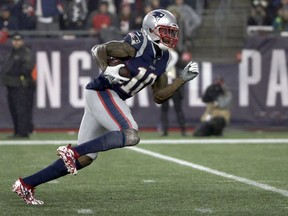 FILE - In this Dec. 2, 2018, file photo, New England Patriots wide receiver Josh Gordon runs for a touchdown after catching a pass during the second half of an NFL football game against the Minnesota Vikings in Foxborough, Mass. The Patriots aren't ready to give up on the possibility of Gordon playing football again in New England. The team extended qualifying offers to the restricted free agent receiver as well as defensive back Jonathan Jones on Wednesday, March 13. Gordon could rejoin New England only if he's reinstated from his latest suspension for violating an agreement that allowed him to play after multiple drug suspensions.
