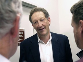 FILE - In this Monday, Oct. 5, 2015 file photo, San Francisco Giants president and CEO Larry Baer speaks to reporters after a news conference in San Francisco. A video posted by TMZ on Friday, March 1, 2019 shows Giants President and CEO Larry Baer in a physical altercation with his wife in a San Francisco park. Baer's wife, Pam, was seated in a chair when he reached over her to grab for a cellphone in her right hand and she toppled sideways in the chair screaming "Oh my God!" and kicking a leg. Witnesses saw the ordeal in the public plaza.