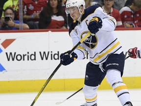 FILE - In this Dec. 21, 2018, file photo, Buffalo Sabres center Jack Eichel (9) winds up for a shot during the second period of an NHL hockey game against the Washington Capitals, in Washington. Oilers captain Connor McDavid acknowledges how the constant losing has begun to wear on him. In Buffalo, Sabres captain Jack Eichel grew frustrated in saying he can't pinpoint a reason for his team's long string of inconsistency. What's become abundantly clear, as the top-two picks in the 2015 draft meet in Buffalo on Monday, March 4, 2019, is it takes more than one so-called "generational" star to transform a losing team into a contender.