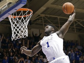 FILE - In this Jan. 5, 2019, file photo, Duke's Zion Williamson (1) dunks during the second half of an NCAA college basketball game against Clemson, in Durham, N.C. Williamson was named both The Associated Press ACC player and newcomer of the year, Tuesday, March 12, 2019.