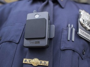 FILE - In this April 27, 2017 file photo, a police officer wears a newly-issued body camera outside in New York. In 2018, the New York City Police Department, the nation's largest, stopped releasing body camera video after a police union successfully argued in court that they were confidential personnel records. But the department vowed in February 2019 to continue releasing video of officer-involved shootings after an appeals court ruled that the union's argument "would defeat the purpose of the body-worn-camera program."