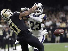 FILE - In this Jan. 20, 2019, file photo, Los Angeles Rams' Nickell Robey-Coleman (23) breaks up a pass intended for New Orleans Saints' Tommylee Lewis during the second half of the NFL football NFC championship game in New Orleans. The blatant non-call late in the NFC championship game caused passionate consternation among Saints fans and led to calls for change in the NFL's replay system. But there is not a lot of support for such a change because of the time it would add to games.