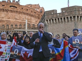 FILE - In this Feb. 21, 2019, file photo, sex abuse survivor Peter Isely, of the U.S. founded Ending Clergy Abuse organization, speaks during a twilight vigil prayer near Castle Sant' Angelo, in Rome. A wrenching season for three of America's largest religious denominations as sex-abuse scandals and a schism over LGBT inclusion fuel anguish and anger within the Roman Catholic, Southern Baptist and United Methodist churches.