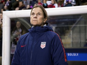 FILE - In this Feb. 27, 2019, file photo, USA head coach Jill Ellis looks on before the first half of SheBelieves Cup soccer match against Japan in Chester, Pa. FIFA's financial results underscore the glaring disparity between men and women's soccer. France banked $38 million from FIFA for winning the championship in 2018, but the women's champion this July will earn just $4 million. Ellis, who is leading her team's title defense in France, said she is disappointed with the financial rewards.