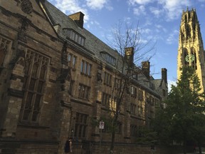 FILE - This Sept. 9, 2016 photo shows Harkness Tower on the campus of Yale University in New Haven, Conn. Dozens of people were charged Tuesday, March 12, 2019, in a scheme in which wealthy parents allegedly bribed college coaches and other insiders to get their children into some of the nation's most elite schools. The coaches worked at such schools as Yale, Wake Forest, Stanford, Georgetown, the University of Texas, the University of Southern California and the University of California, Los Angeles. A former Yale soccer coach pleaded guilty and helped build the case against others.