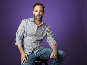 FILE - In this Aug. 6, 2018, file photo, Luke Perry poses for a portrait during the 2018 Television Critics Association Summer Press Tour in Beverly Hills, Calif. A publicist for Perry says the "Riverdale" and "Beverly Hills, 90210" star has died. He was 52. Publicist Arnold Robinson said that Perry died Monday, March 4, 2019, after suffering a massive stroke.
