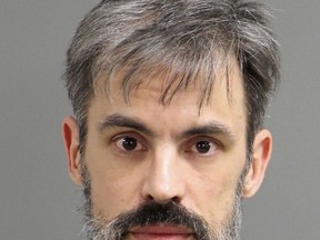 This Monday, March 4, 2019, booking photo provided by the Raleigh/Wake City-County Bureau of Identification shows Jonathan Williams, 42, of Raleigh, whom authorities have charged with littering after they say he placed white hoods on a Confederate statue featuring a woman and a young boy on the grounds of North Carolina's Capitol in Raleigh, N.C. (Raleigh/Wake City-County Bureau of Identification via AP)