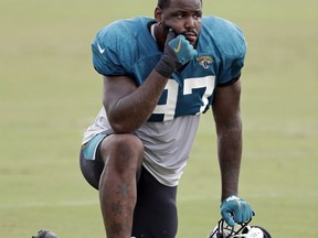 FILE - In this July 31, 2018, file photo, Jacksonville Jaguars defensive tackle Malik Jackson takes a break during a practice at NFL football training camp, Tuesday,, in Jacksonville, Fla. The Jaguars have released defensive tackle Malik Jackson, safety Tashaun Gipson, offensive lineman Jermey Parnell, running back Carlos Hyde and long-snapper Carson Tinker, creating $30 million in salary cap space for 2019, the team announced Friday, March 8, 2019.