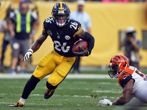 FILE - In this Oct. 22, 2017, file photo, Pittsburgh Steelers running back Le'Veon Bell (26) carries the ball during an NFL football game against the Cincinnati Bengals in Pittsburgh. A person with direct knowledge of the negotiations says the New York Jets and Bell have agreed to a deal early Wednesday morning, Mach 13, 2019, a person with direct knowledge of the negotiations told The Associated Press. The deal gives new coach Adam Gase and second-year quarterback Sam Darnold a big-time playmaker, arguably the best player at his position before Bell opted to sit out all of last season rather than sign a franchise tender with Pittsburgh.