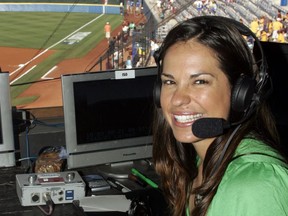 FILE - In this May 29, 2009, file photo, USA softball player Jessica Mendoza poses for a photo in the ESPN broadcast booth at the Women's College World Series in Oklahoma City. Mendoza has been hired as a baseball operations adviser for the New York Mets while remaining a broadcaster for ESPN's "Sunday Night Baseball." The move, announced Tuesday, March 5, 2019, is part of an increasing number of television commentators who also work for teams.