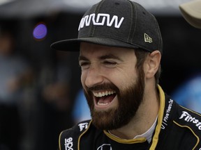 FILE - In this Aug. 18, 2018, file photo, James Hinchcliffe laughs during practice for the IndyCar series auto race in Long Pond, Pa. The US-based series runs the first IndyCar Classic in Austin, Texas this week with a special bonus of $100,000 if the driver who qualifies in pole position also wins the race.