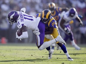FILE - In this Sept. 27, 2018, file photo, Minnesota Vikings wide receiver Laquon Treadwell (11) is tackled by Los Angeles Rams defensive back Lamarcus Joyner during the first half in an NFL football game in Los Angeles.  The Oakland Raiders have agreed to a four-year contract with free agent safety Lamarcus Joyner. A person familiar with the deal said Tuesday, March 12, 2019, on condition of anonymity, that Joyner will sign the contract after the start of the new league year. The person spoke on condition of anonymity because the move can't be finalized until Wednesday.