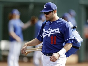 FILE - In this Feb. 24, 2019, file photo, Los Angeles Dodgers' A.J. Pollock walks to the field for a spring training baseball game against the Los Angeles Angels in Glendale, Ariz. Pollock signed a $55 million, four-year deal to leave division rival Arizona. He gives the Dodgers a right-handed bat to complement their deep lineup.