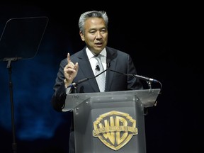 FILE - This April 21, 2015 file photo shows Kevin Tsujihara, chairman and CEO of Warner Bros., during the Warner Bros. presentation at CinemaCon 2015 in Las Vegas. Tsujihara is stepping down after claims that he promised acting roles in exchange for sex.  As Warner Bros. chairman and chief executive officer at one of Hollywood's most powerful and prestigious studios, Tsujihara is one of the highest ranking executives to be felled by sexual misconduct allegations.