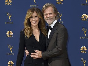 FILE - In this Sept. 17, 2018 file photo, Felicity Huffman, left, and William H. Macy arrive at the 70th Primetime Emmy Awards in Los Angeles.  Huffman and Lori Loughlin were charged along with nearly 50 other people Tuesday, March 12, 2019, in a scheme in which wealthy parents bribed college coaches and insiders at testing centers to help get their children into some of the most elite schools in the country, federal prosecutors said. Court papers said a cooperating witness met with Huffman and Macy, at their Los Angeles home and explained the scam to them. The cooperator told investigators that Huffman and her spouse "agreed to the plan."