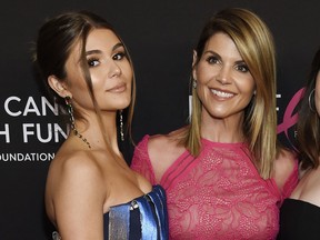 In this Feb. 28, 2019 file photo, actress Lori Loughlin poses with her daughter Olivia Jade Giannulli, left, at the 2019 "An Unforgettable Evening" in Beverly Hills, Calif.