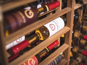 In this undated photo released by Route des Saveurs, a bottle of tomato-based wine waits to be sold at Omerto in Baie-Saint-Paul, Quebec in Canada. Omerto owner Pascal Miche took an idea from his grandfather and created the wine through years of trial and error.