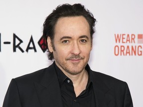 FILE - In this Dec. 1, 2015 file photo, actor John Cusack attends the premiere of "Chi-Raq" in New York. The Tribeca Film The Tribeca Film Festival announced Thursday that writer-director Cameron Crowe and the cast of "Say Anything..." led by John Cusack will celebrate the 30th anniversary of the classic romance. The 18th Tribeca Film Festival runs April 25-May 5.