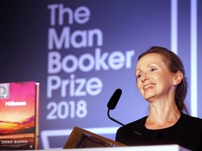 FILE - In this Oct. 16, 2018 file photo, author Anna Burns smiles after being presented with the Man Booker Prize for Fiction 2018 for "Milkman," during the prize's 50th year at the Guildhall in London. Burns' "Milkman" has been awarded the National Book Critics Circle prize for fiction.