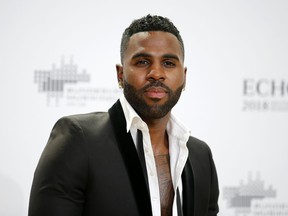 FILE - In this April 12, 2018 file photo, singer Jason Derulo poses during a photocall upon arrival for the 2018 Echo Music Awards in Berlin. In "Let's Shut Up & Dance," the R&B singer collaborates with Asian K-pop acts Lay Zhang and NCT 127 in a trans-Pacific partnership he thinks ought to be increasingly common in the musical future.