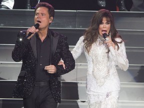 FILE - This Aug. 22, 2017 file photo shows Donny Osmond, left, and Marie Osmond performing at the Santander Arena in Reading, Pa. Donny and Marie Osmond say they will end their Las Vegas show later this year, concluding an 11-year run on the Strip. The brother-sister duo made the announcement during an appearance on "Good Morning America" on Thursday, March 21, 2019. Their final performance at the Flamingo Las Vegas is scheduled for Nov. 16.