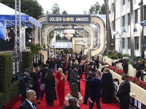 FILE - This Jan. 6, 2019 file photo shows members of the media on the red carpet prior to the 76th annual Golden Globe Awards  in Beverly Hills, Calif. The Hollywood Foreign Press Association (HFPA), dick clark productions (dcp) and NBC will present the 77th Annual Golden Globe Awards on Jan. 5, 2020.