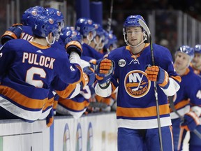 New York Islanders' Tom Kuhnhackl is congratulated after scoring a goal during the first period of an NHL hockey game against the Washington Capitals on Friday, March 1, 2019, in Uniondale, N.Y.