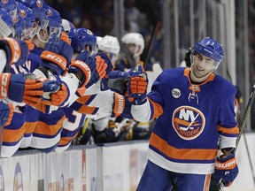 New York Islanders' Jordan Eberle celebrates with teammates after scoring a goal during the first period of an NHL hockey game against the Buffalo Sabres Saturday, March 30, 2019, in Uniondale, N.Y.